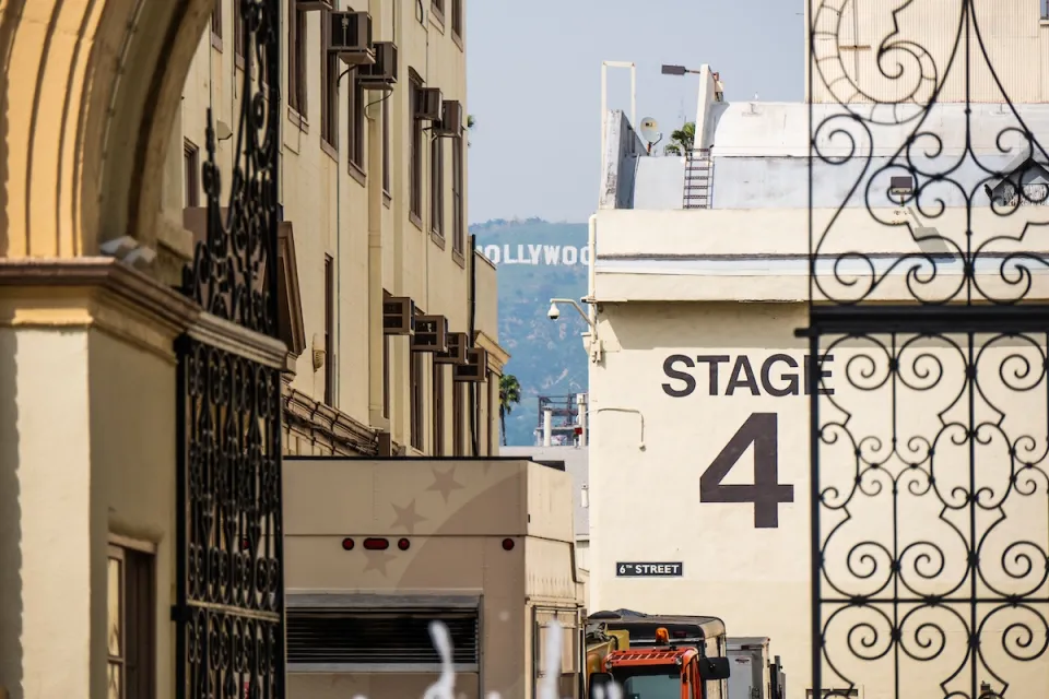 "Stage 4" soundstage wall seen through ornate metal gate at Paramount Studios lot in Los Angeles, California.